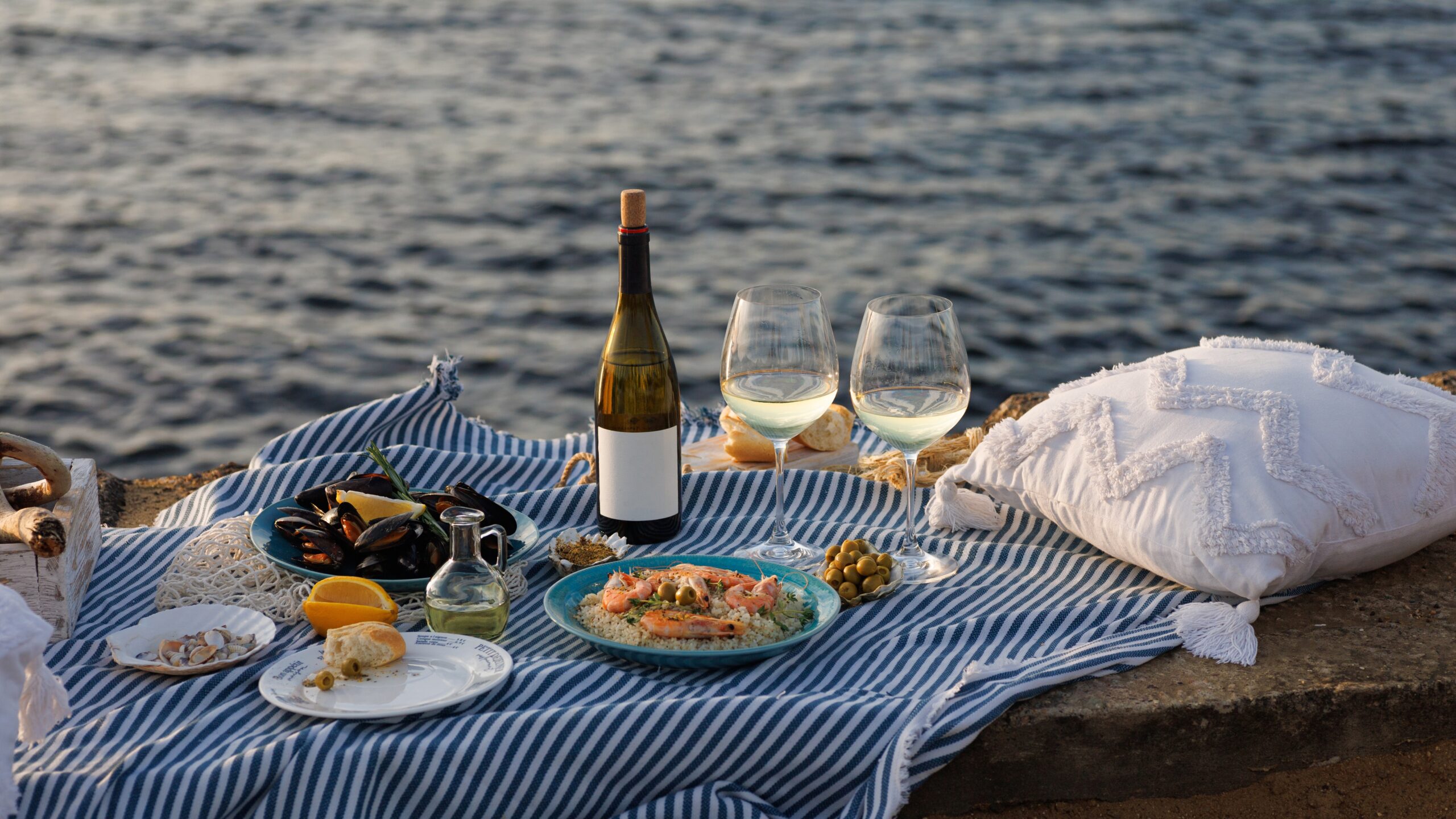 Seafood delicacies and two glasses of wine with a sea view in Mykonos